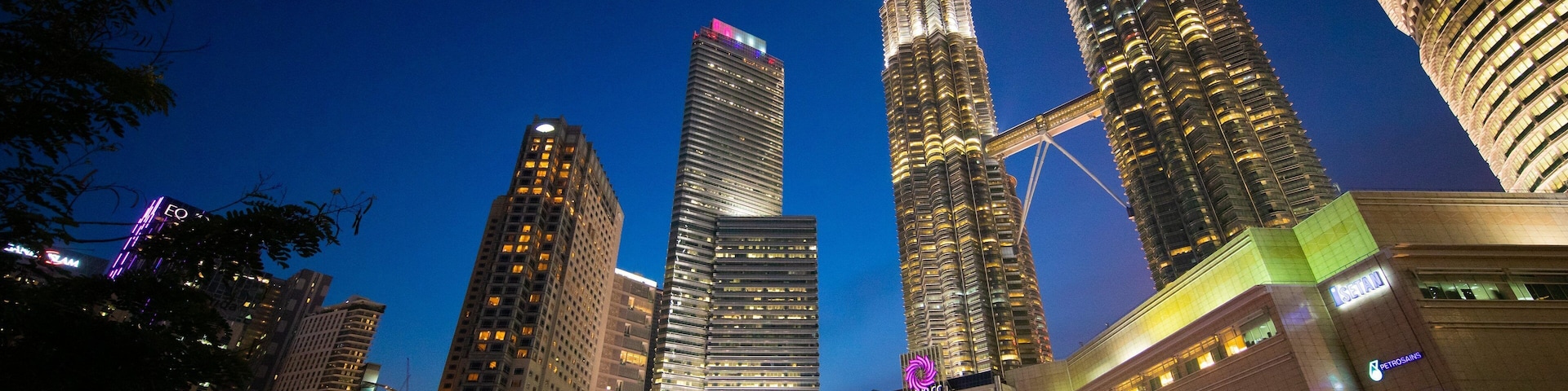 KLCC Park showing night scenes, a skyscraper and a city