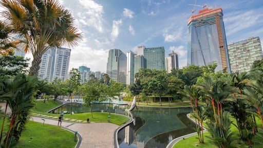 KLCC Park showing a park, a pond and a city