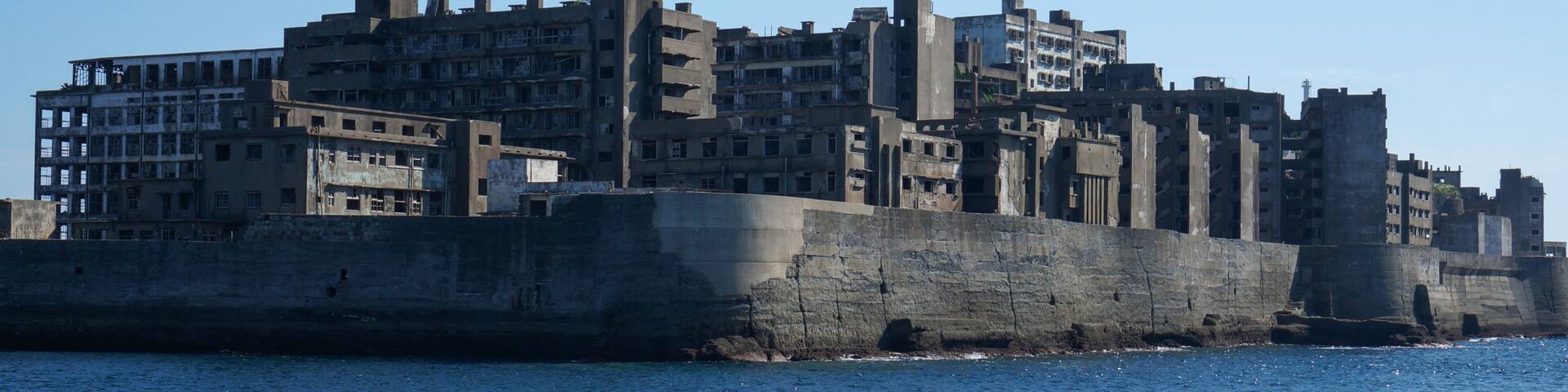 Gunkanjima is an abandoned city of a coal miners on the Hashima island in Japan. Panoramic view.
