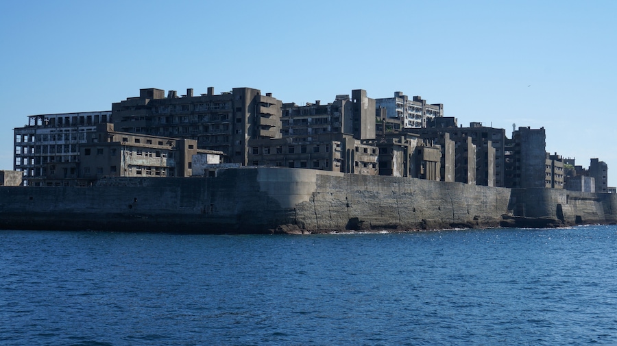 Gunkanjima is an abandoned city of a coal miners on the Hashima island in Japan. Panoramic view.