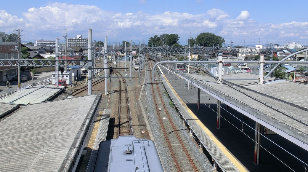 An overview of the platforms at Hanyu Station in Saitama Prefecture, Japan, looking north, with the Chichibu Railway platforms on the left and the Tobu platforms on the right