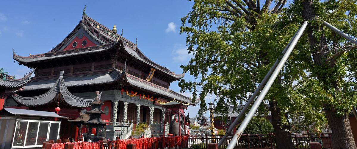 A traditional Chinese building with ornate architecture, including curved roofs and decorative elements.