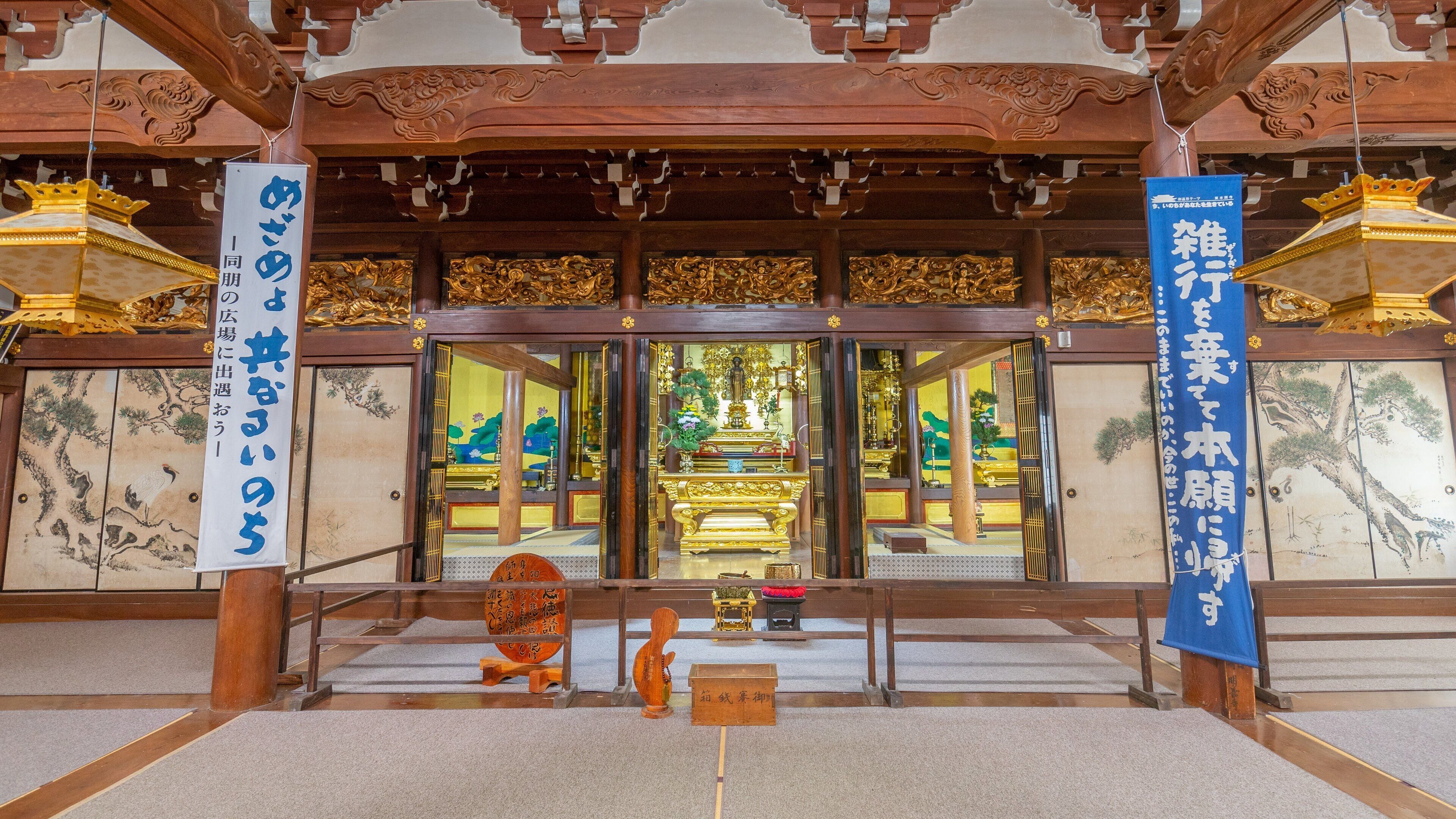 Shirakawa showing a temple or place of worship, signage and art