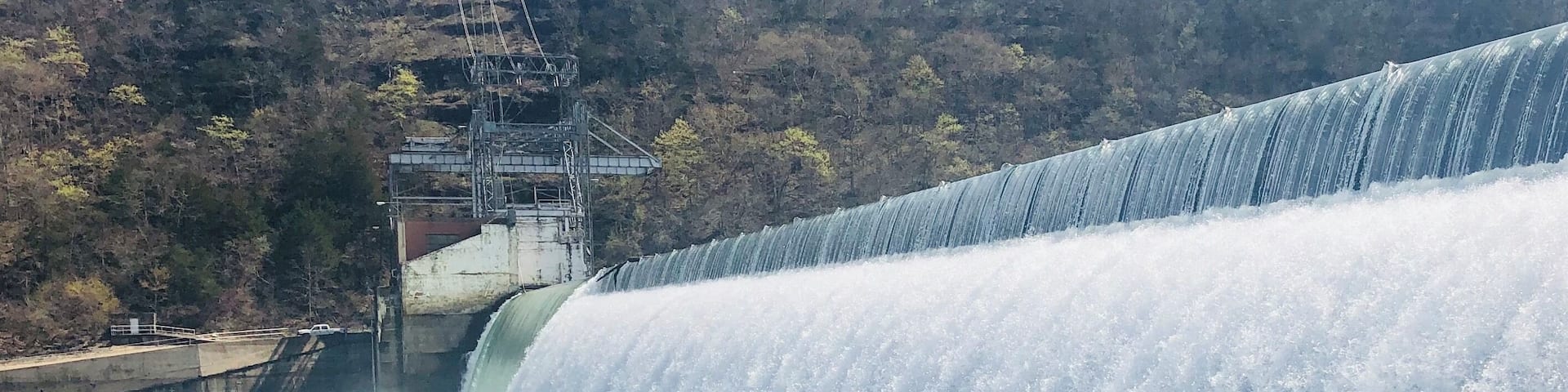 A large dam with a waterfall.