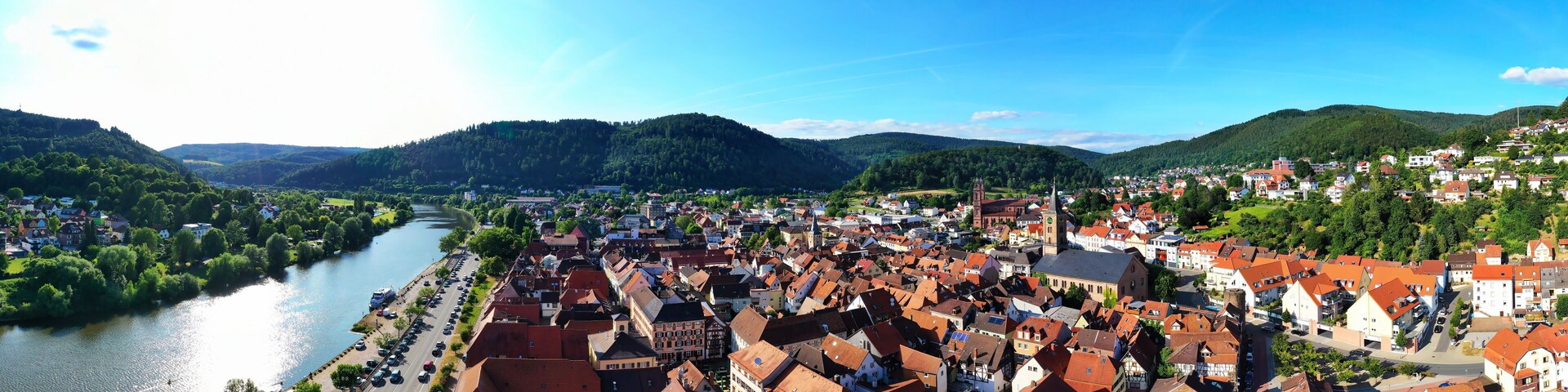 A riverside town with historic buildings and a river.