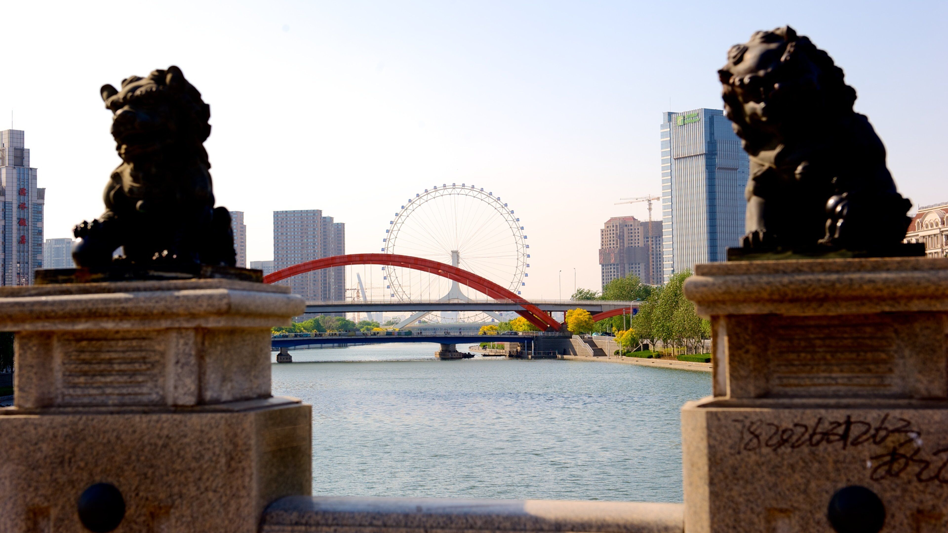Ojo de Tianjin mostrando un río o arroyo, una ciudad y un puente