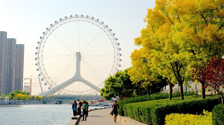 Tianjin Eye which includes a river or creek, rides and street scenes