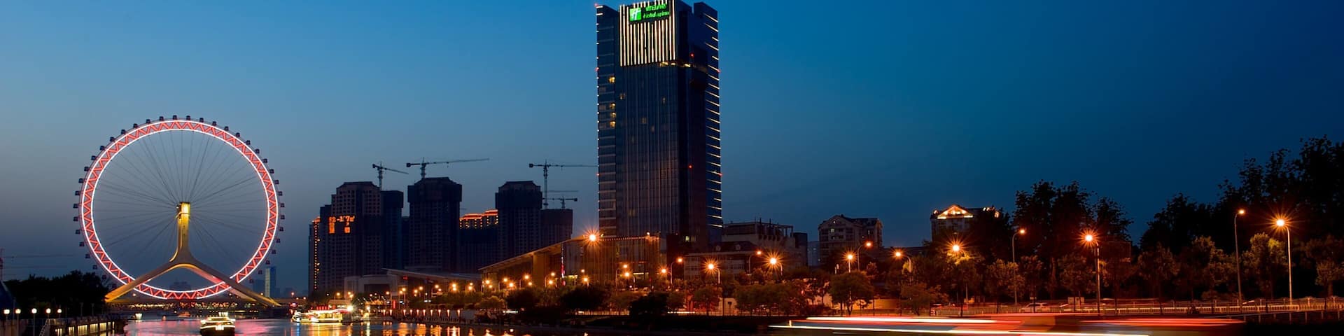 Tianjin Eye showing night scenes, a river or creek and central business district