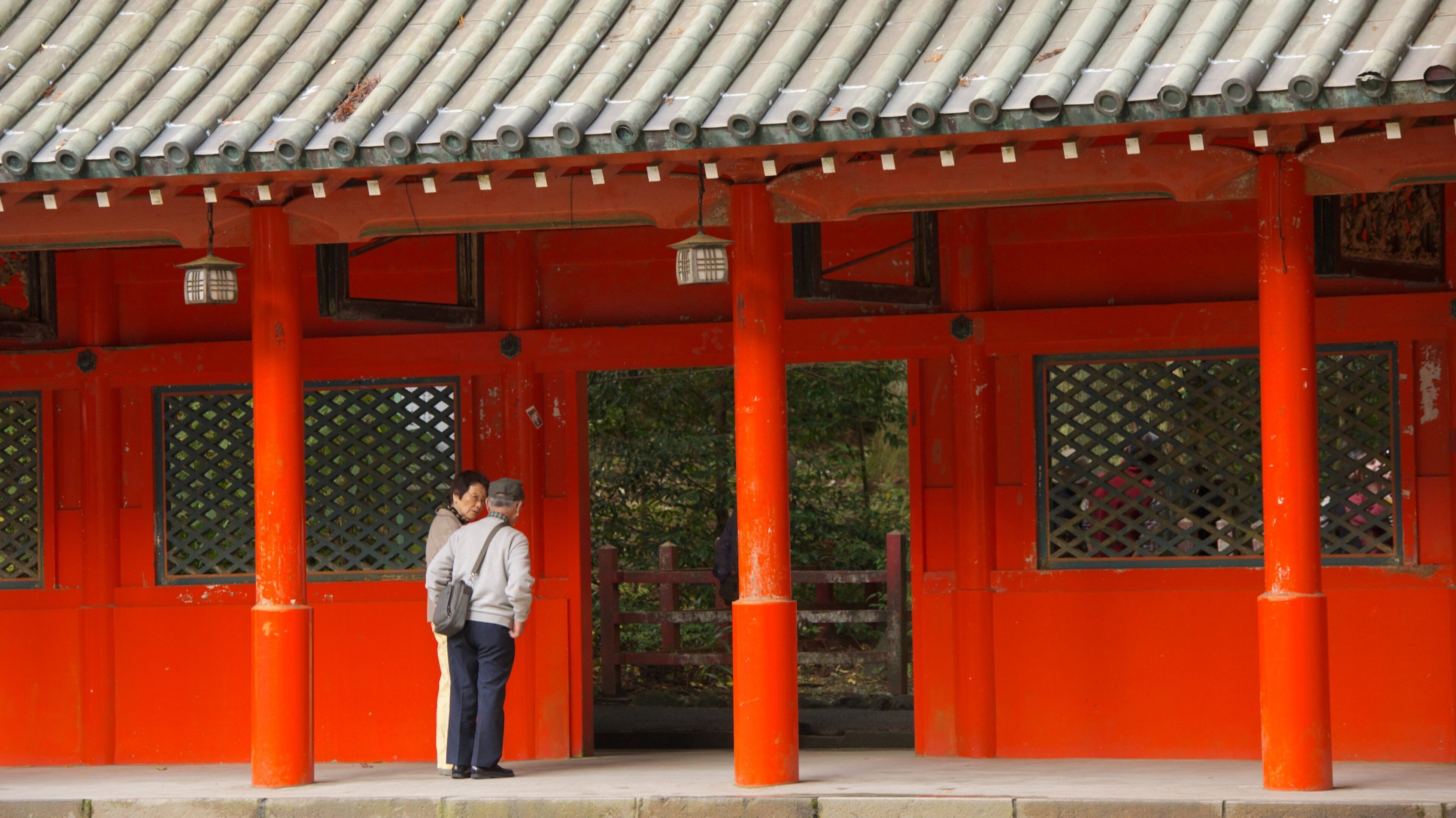 Hakone Shrine featuring a temple or place of worship as well as a small group of people