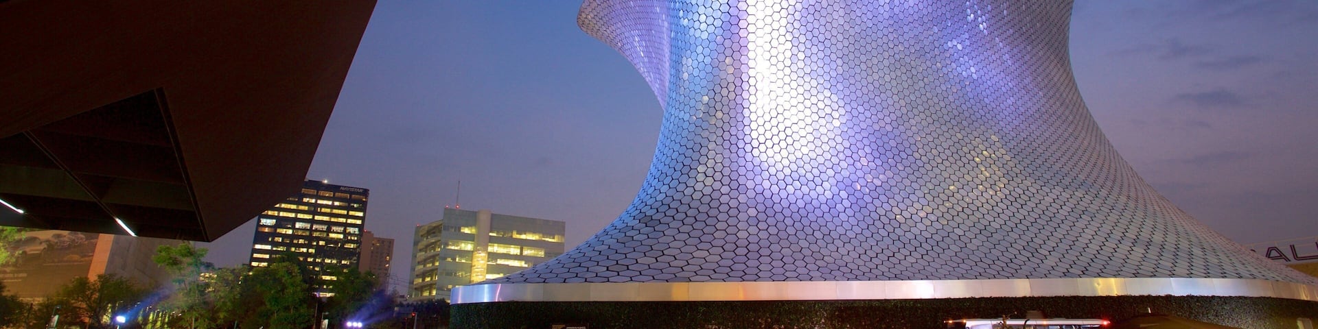 Museo Soumaya which includes modern architecture, night scenes and a square or plaza