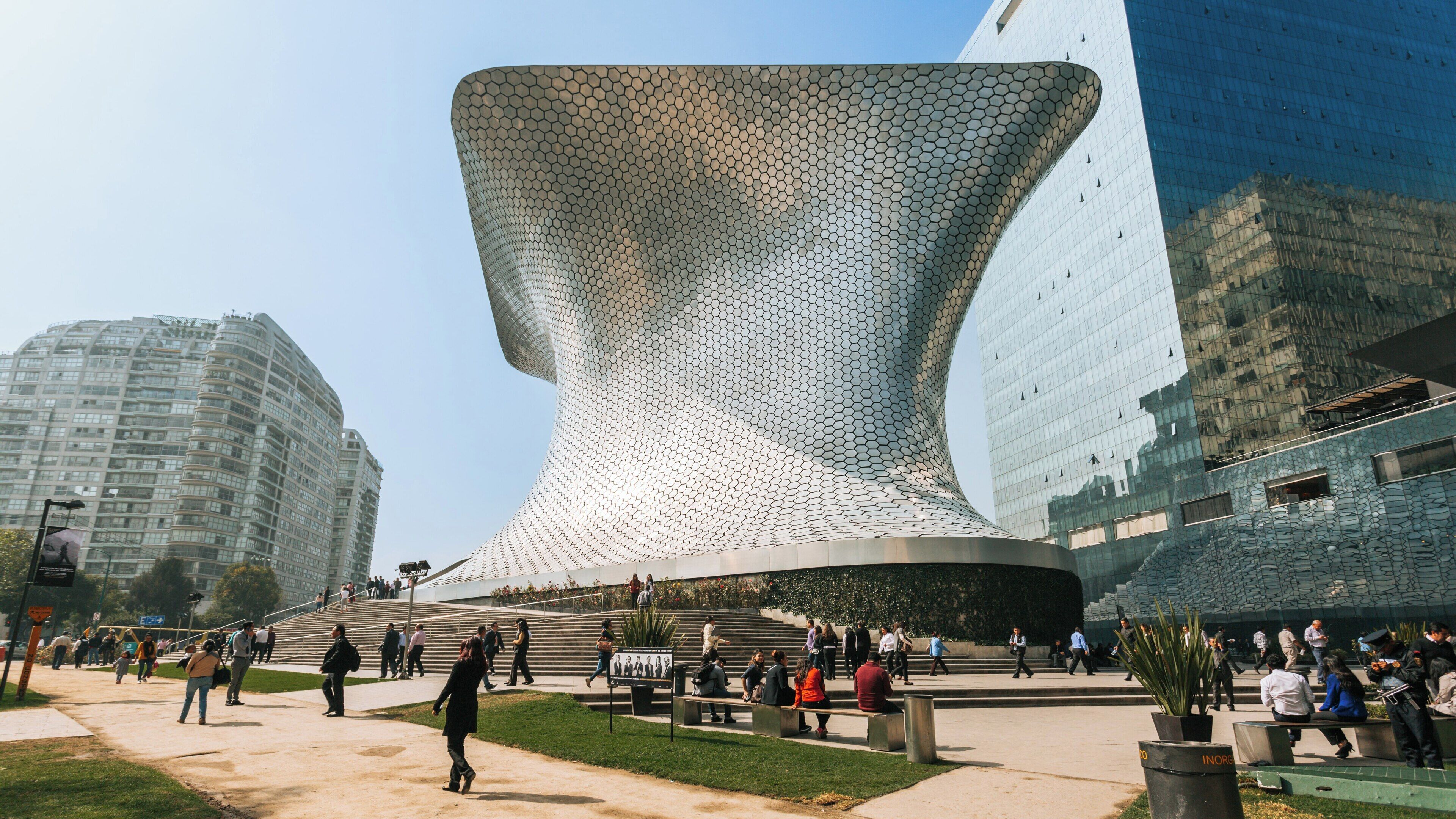 Visit to Soumaya Museum showcasing modern architecture in Miguel Hidalgo, Mexico City, attracting visitors with its unique design and surrounding gardens