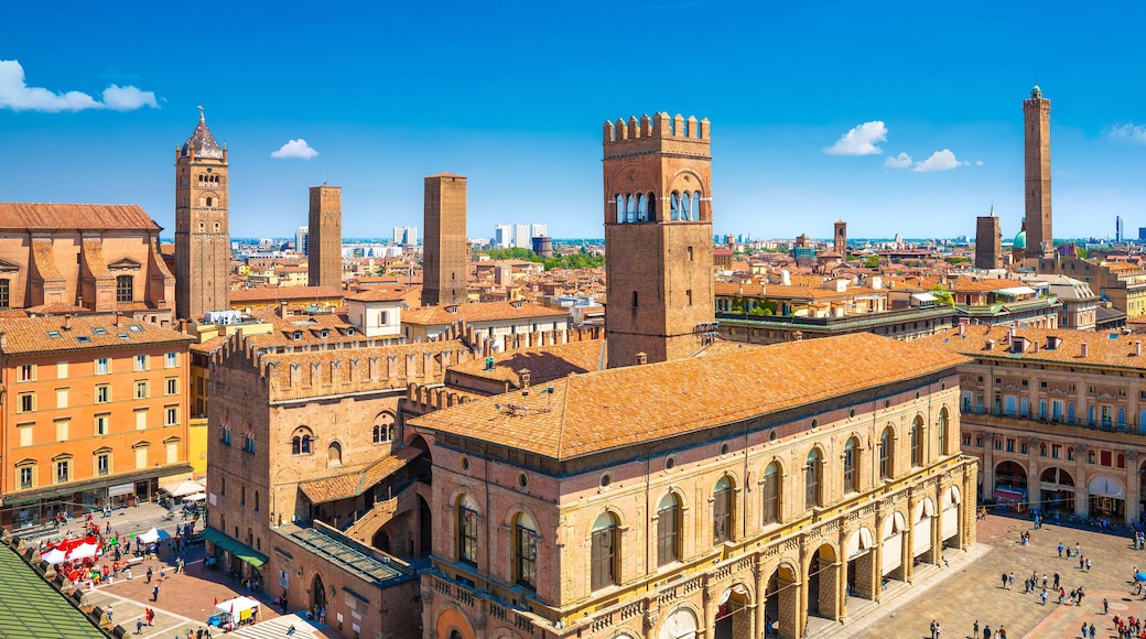 A historic cityscape with prominent towers and a central square.