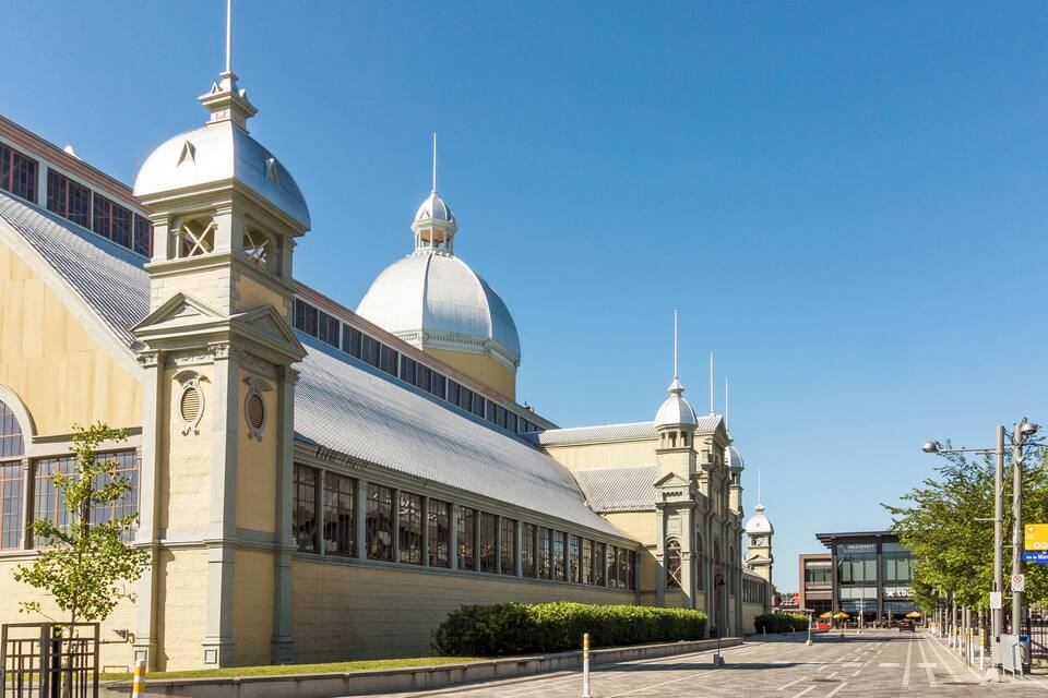 A historic building with large windows and domed roofs.