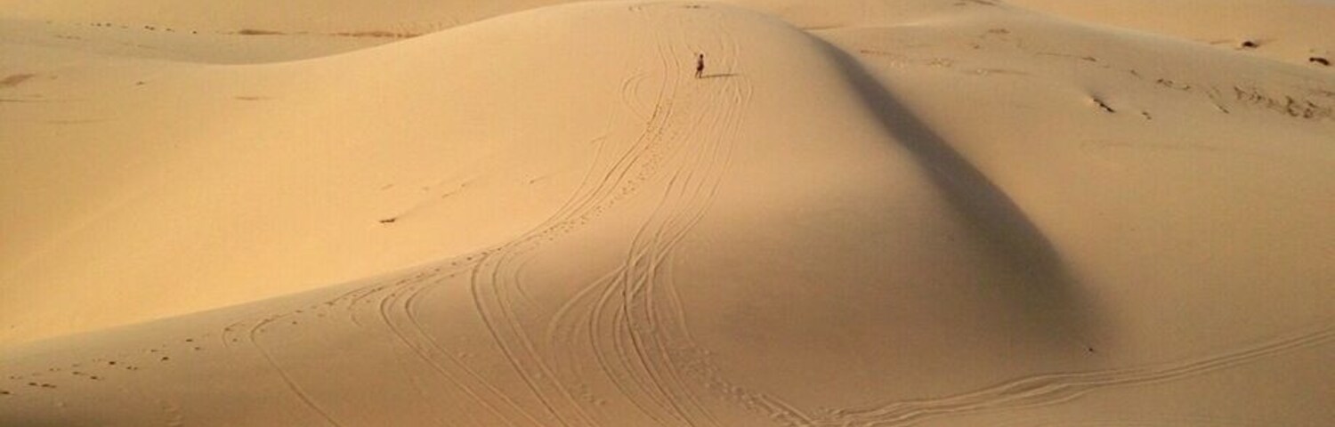 This was the beautiful views of the white sand dunes about 40km from Mui Ne. We did an afternoon trip with Muine Backpackers travel and tour agent. We all went in a Russian Jeep to the Fairy Stream, views overlooking some fishing boats (unfortunately a very polluted beach), then onto the white sand dunes as seen here. After about an hour of running up/down the dunes we went for a sunset at the red sand dunes. All of this for $7 per person. We wanted to rent a scooter but after seeing the roads/roadwork on the way to the white sand dunes we were happy we didn't. Terrain for a jeep or off-road bike. The only downfall was they overbooked the tour and it was a tight squeeze in the back of the Jeep. Overall it was a good trip which combined everything you need to see in Mui Ne or surrounding area. Our recommendation would be to see the White sand dunes and then a sunset at the red sand dunes. Sliding down the dunes on plastic boards the local kids try and sell you for about 25000-40000 dong don't work and ours broke. There are no sand boards to rent unfortunately. #roadtrip