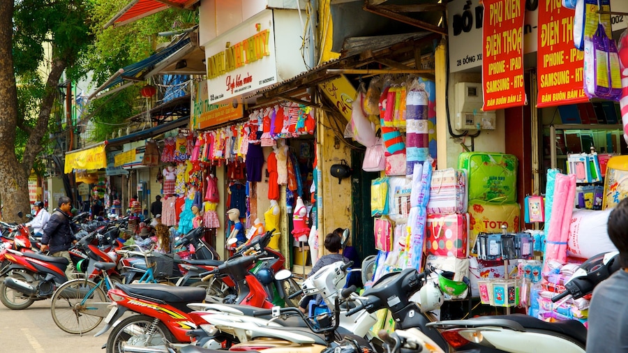 Dong Xuan Market which includes markets, street scenes and a city