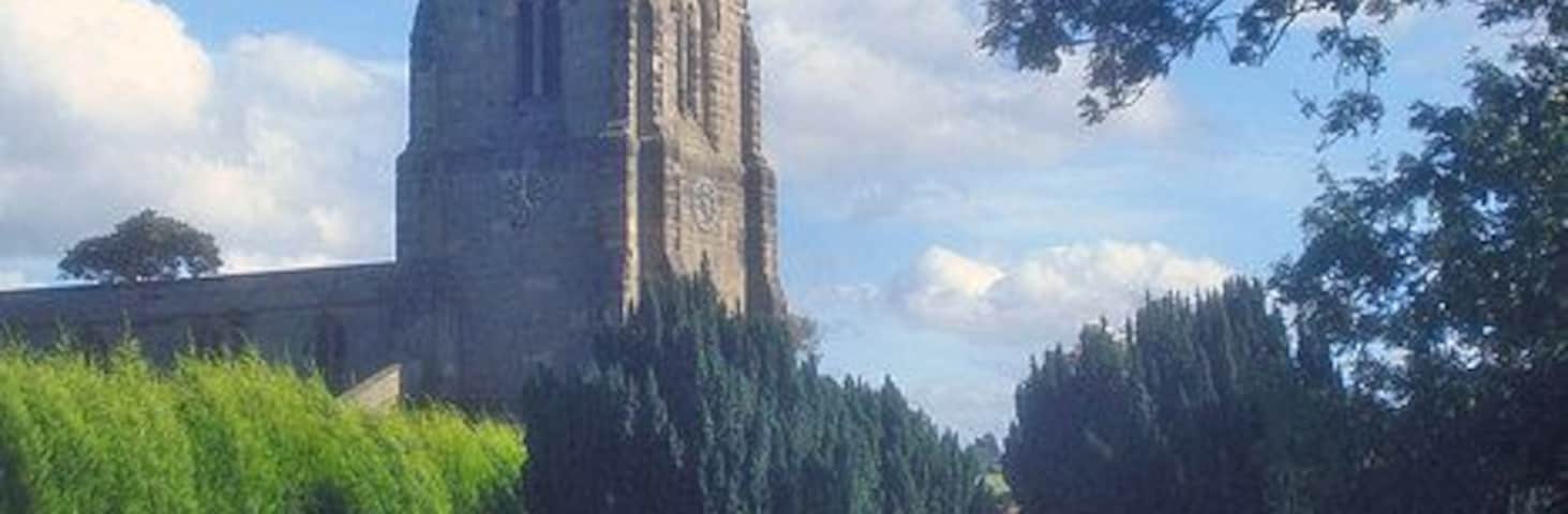 St Denys churchyard Looking south across a very large churchyard which extends all around the church.