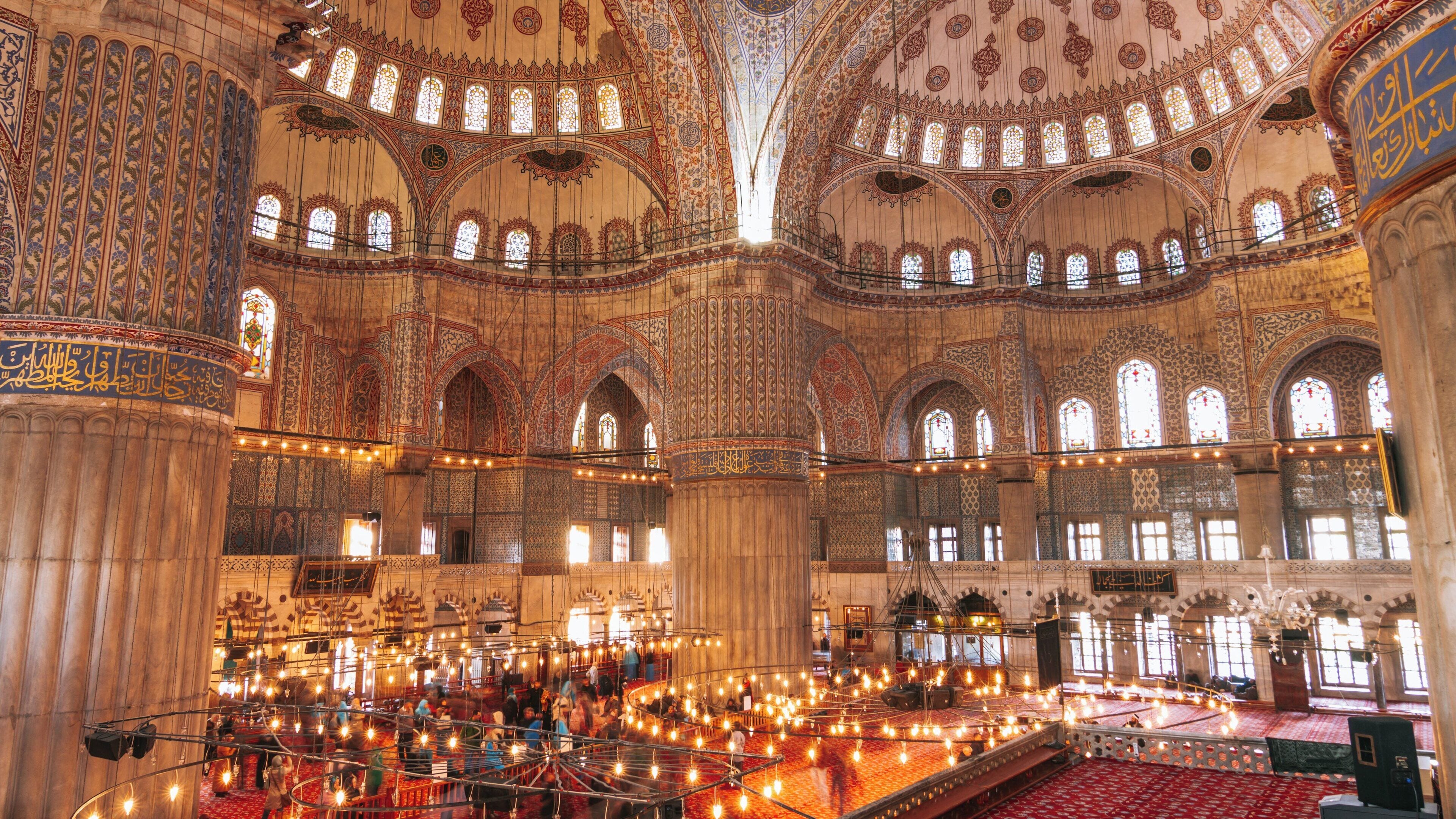Majestic interior of Eyup Sultan Mosque showcasing intricate architecture and beautiful light in Istanbul, Türkiye