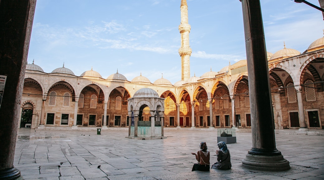 Eyup Sultan Mosque showing heritage architecture and a square or plaza as well as a couple