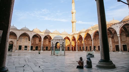 Eyup Sultan Mosque showing heritage architecture and a square or plaza as well as a couple