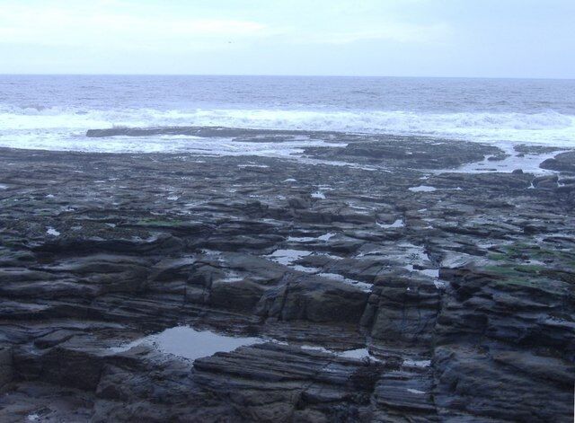 Newbiggin Point Rock strata exposed at low tide.