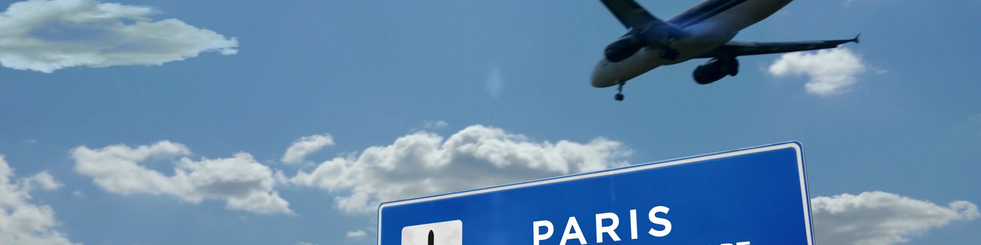 Plane landing in Paris France with signboard