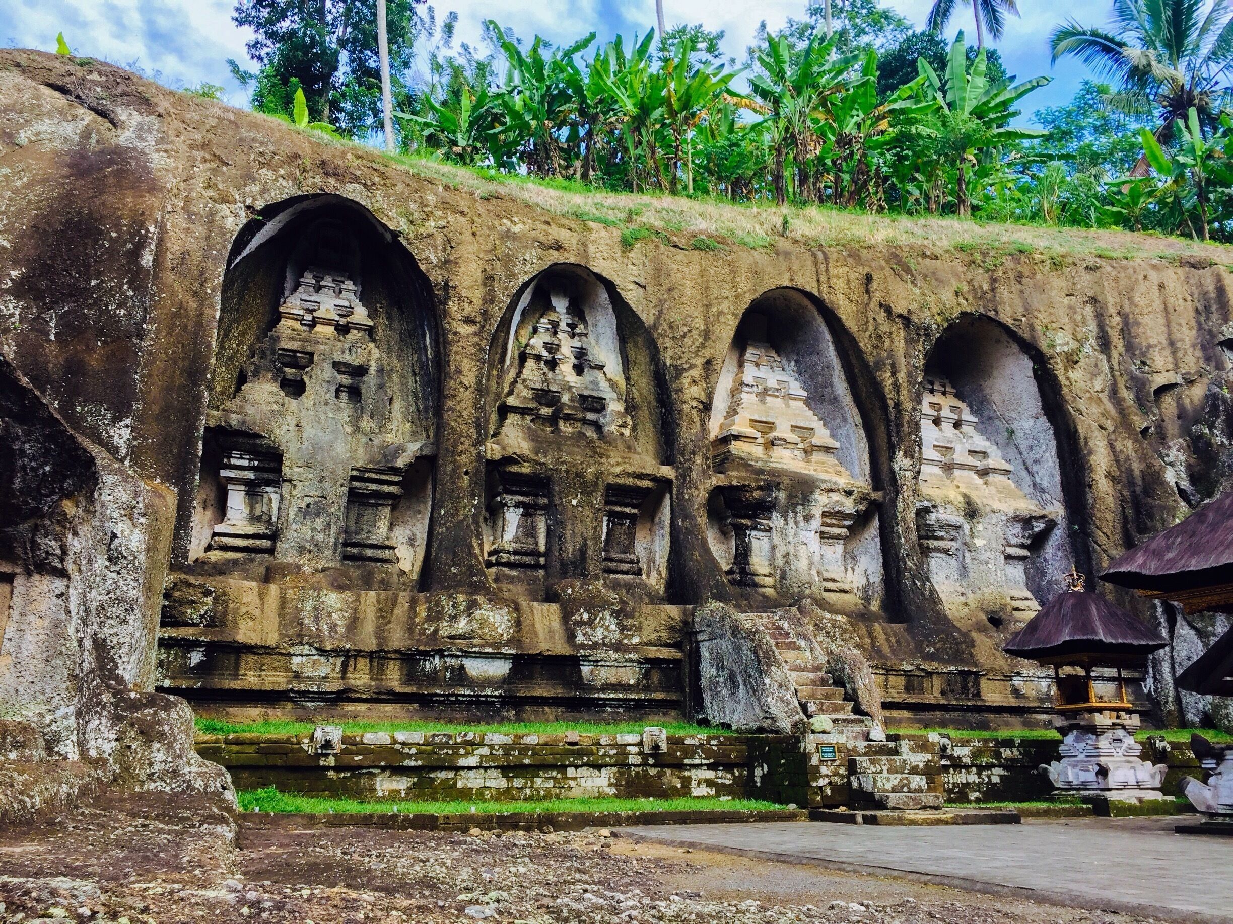 These astonishing temples carved in both side of the gulch cliffs are separated by a river and small bridge.  There are stairs and pathways to the waterfalls and river. This sacred area has great views as your hiking down and up. Stopping for a few breaks is also a good reason to take pictures of the rice fields and lush greenery! 
