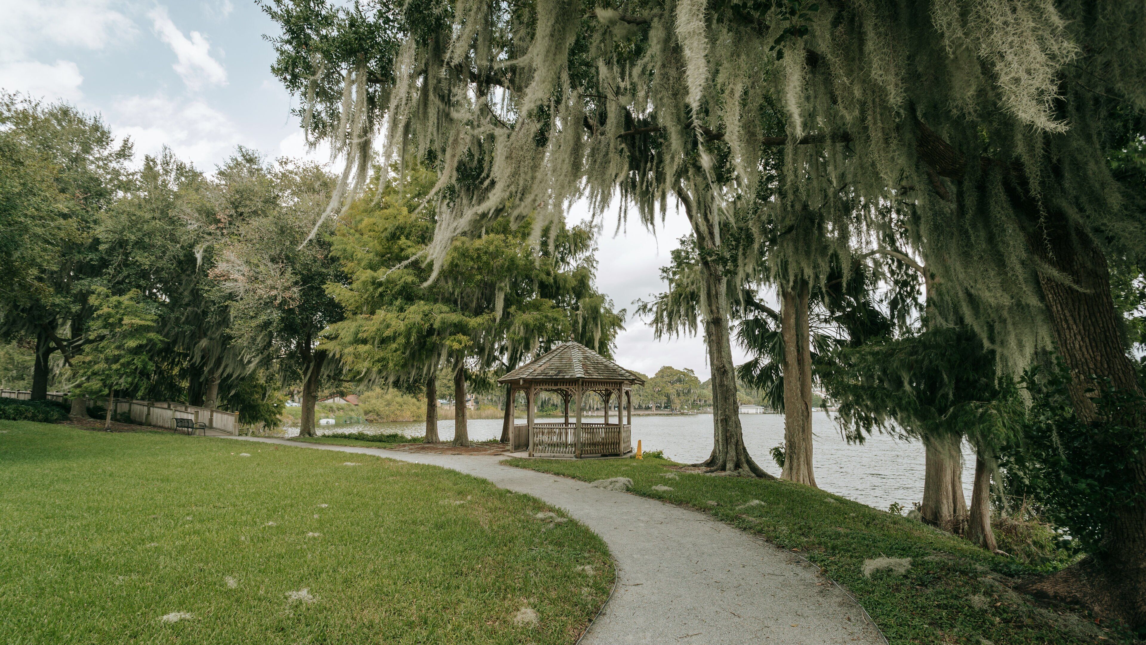 Rollins Museum of Art featuring a park and a lake or waterhole