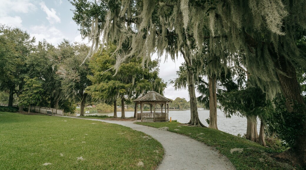 Rollins Museum of Art featuring a park and a lake or waterhole