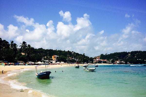 Unawatuna, Sri Lanka has most gorgeous tropical beach you could wish for. Located in a small bay so the waves are low and the water nice and warm. There are nice little cafes and restaurants lining the beach and friendly locals who can take you on a boat ride. #beach