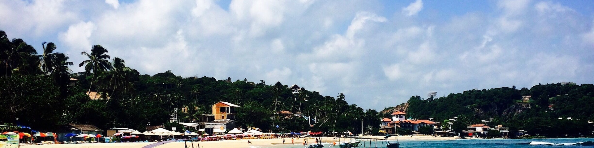 Unawatuna, Sri Lanka has most gorgeous tropical beach you could wish for. Located in a small bay so the waves are low and the water nice and warm. There are nice little cafes and restaurants lining the beach and friendly locals who can take you on a boat ride. #beach