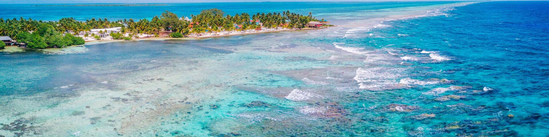 Aerial Drone view of South Water Caye tropical island in Belize barrier reef. A typical Caribbean island with turquoise water