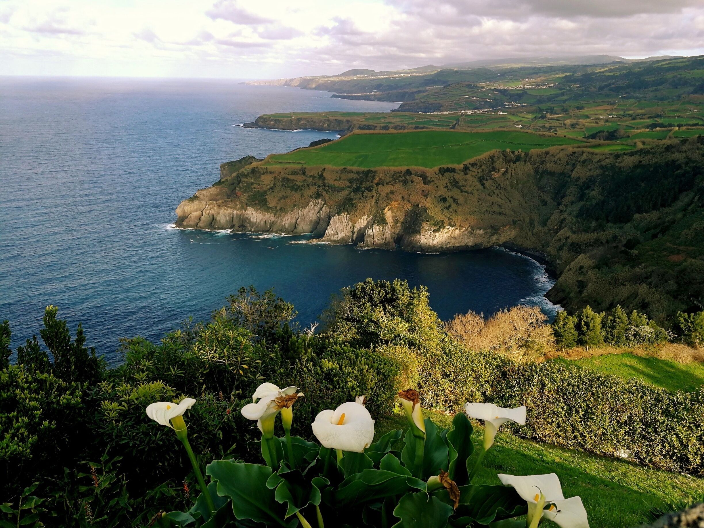 Heralded as one of the island's loveliest viewpoints in my Bradt travel guide, Miradouro de Santa Iria can be found along São Miguel's northern coastline, just east of Ribeira Grande.

You can definitely see for miles and I quite like the effect the late afternoon sun creates.