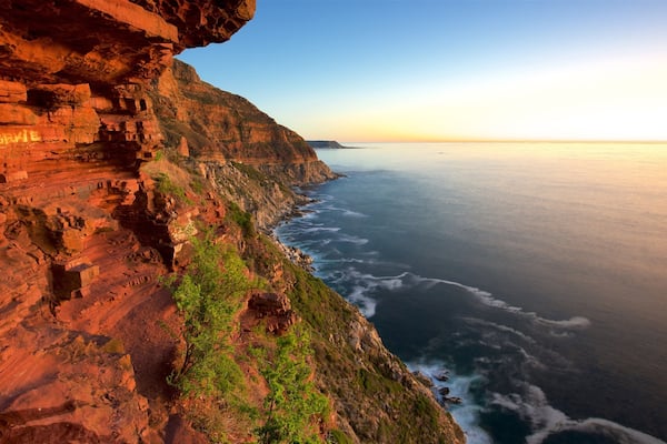 Chapmans Peak showing rocky coastline and a sunset