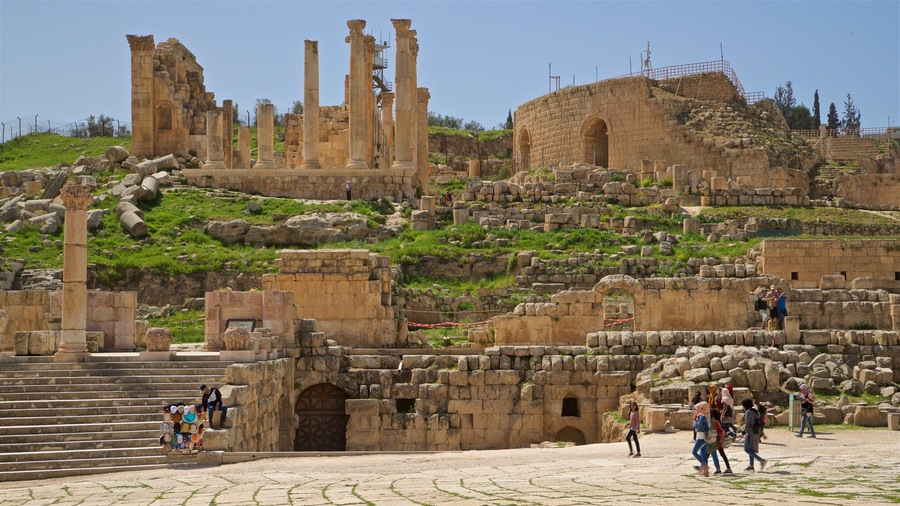 Jerash which includes a ruin and heritage architecture as well as a small group of people