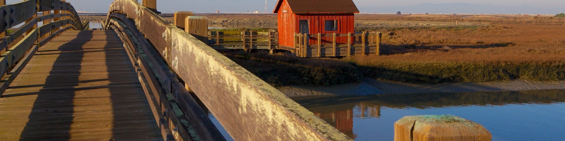 Beautiful twilight at Don Edwards San Francisco Bay National Wildlife Refuge with coastal house and wooden bridge