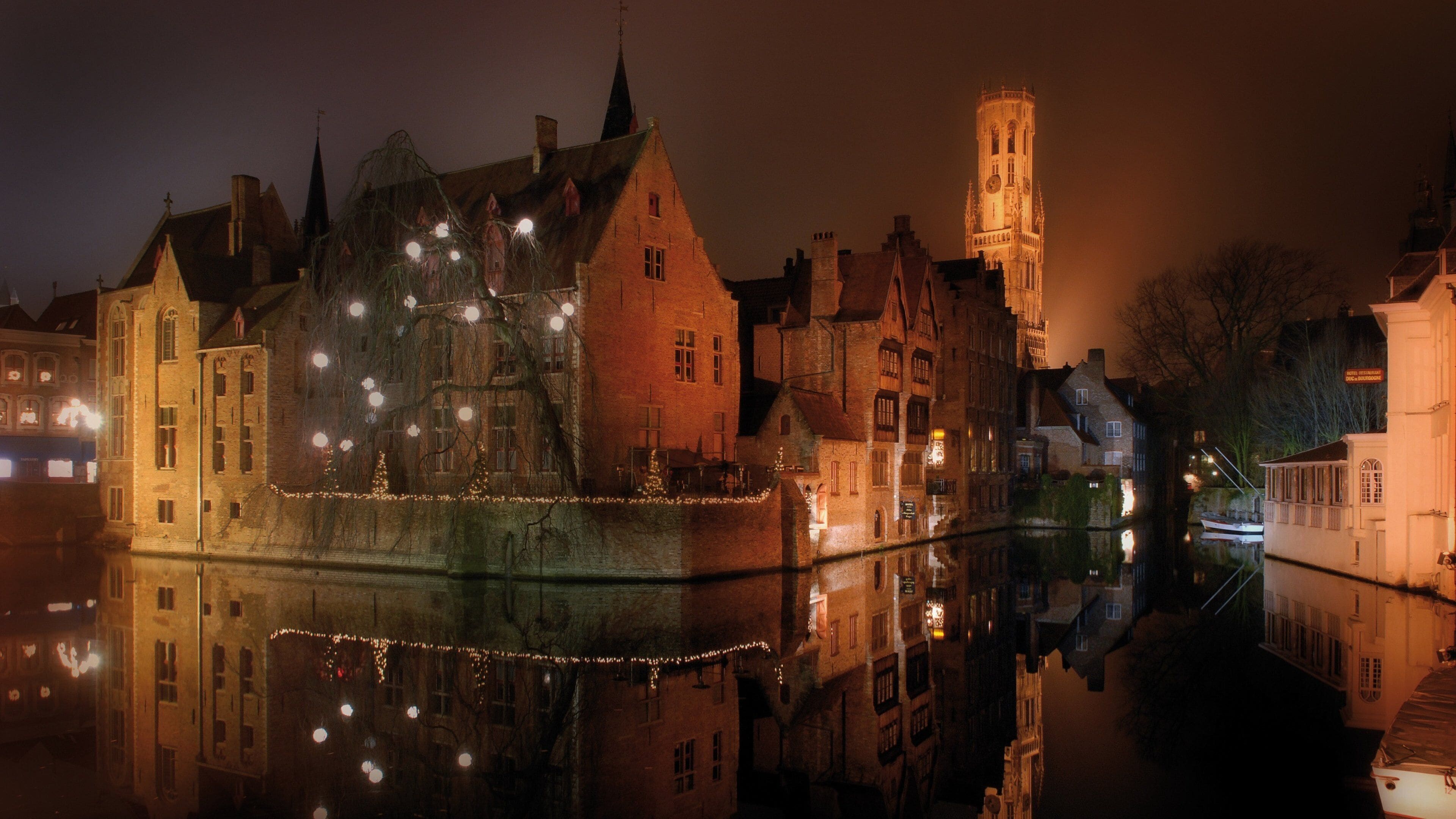 Bruges showing night scenes, mist or fog and a river or creek