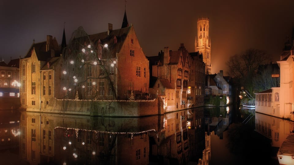 Bruges showing night scenes, mist or fog and a river or creek
