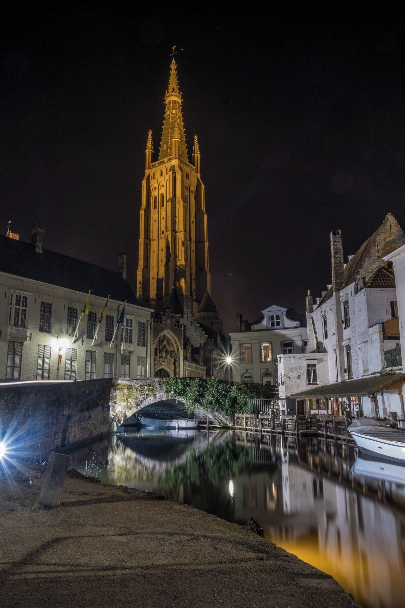 A lovely scene, with the well lit Church and the peaceful water of the canal.