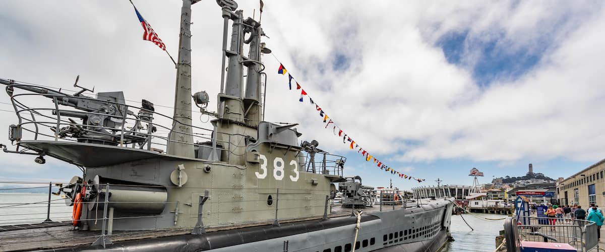 USS Pampanito showing military items and a marina