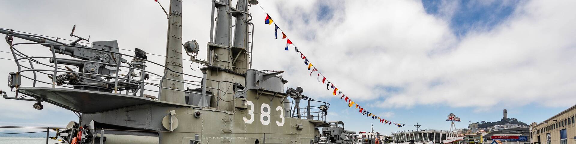 USS Pampanito showing military items and a marina