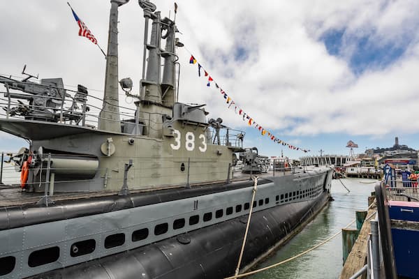 USS Pampanito showing military items and a marina