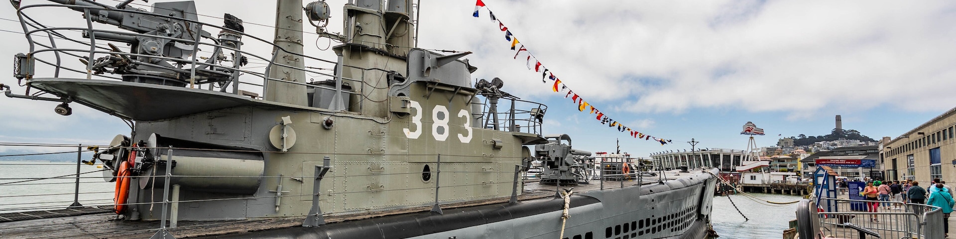 USS Pampanito showing military items and a marina