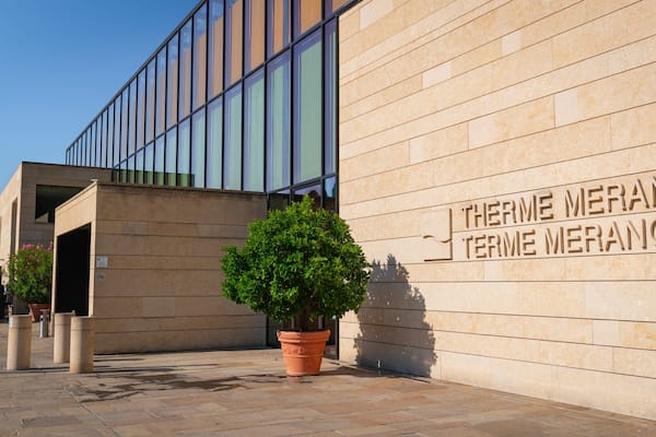 A building with a sign reading "Therme Merano."