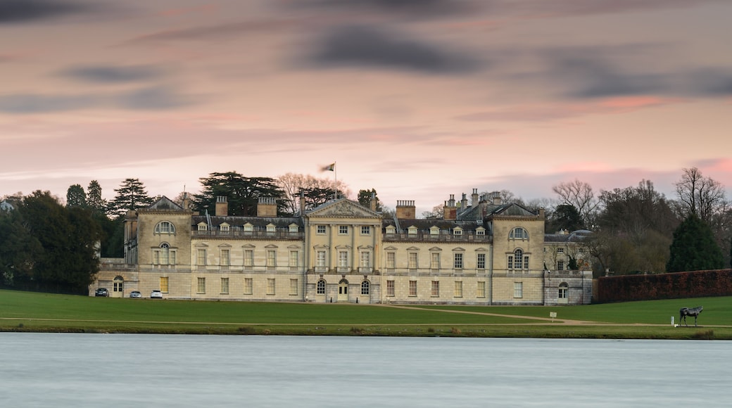 Woburn Abbey, in England, at sunset. Long exposure, blurring the water and clouds