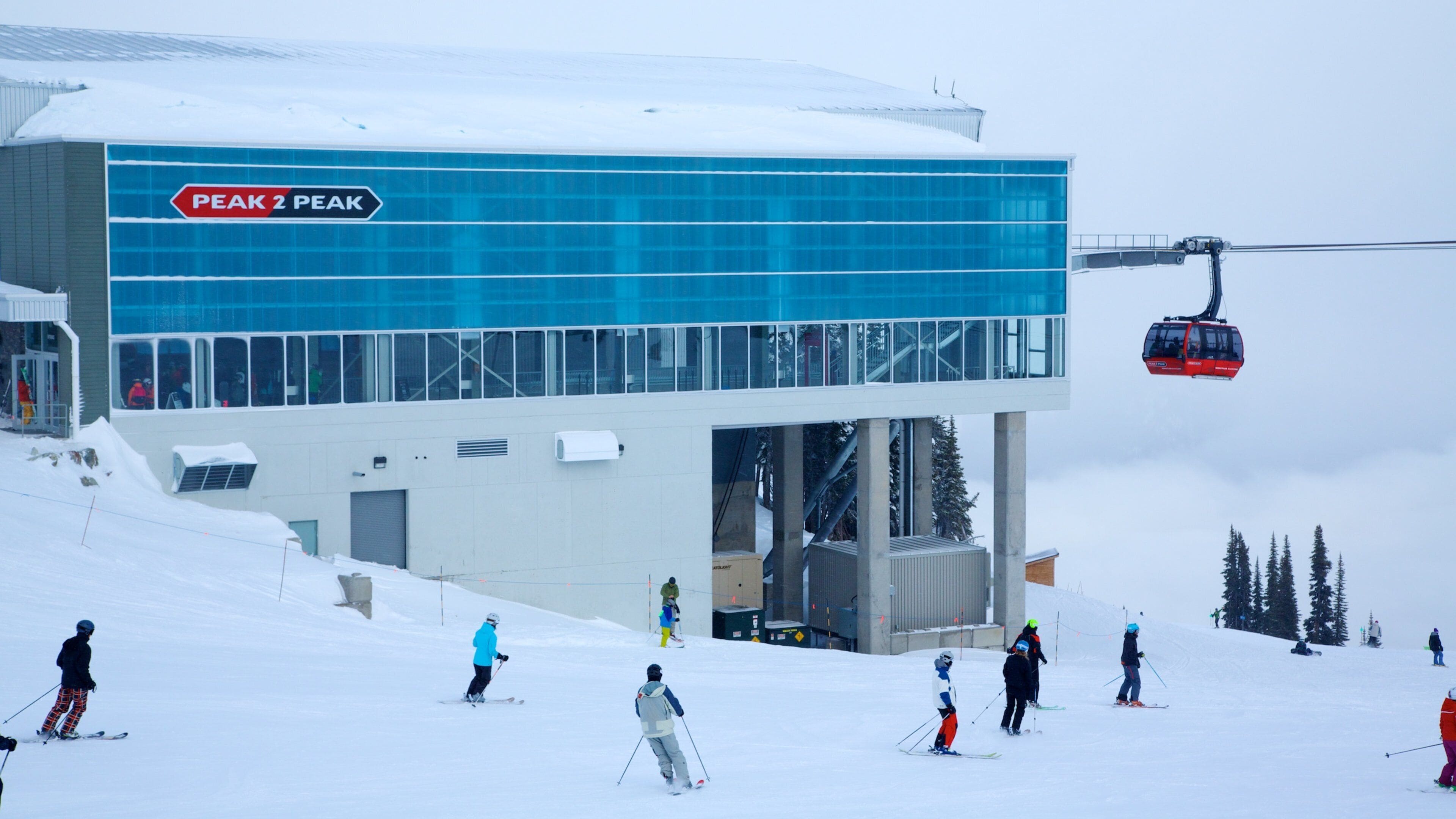 Peak 2 Peak Gondola featuring a gondola, snow and snow skiing