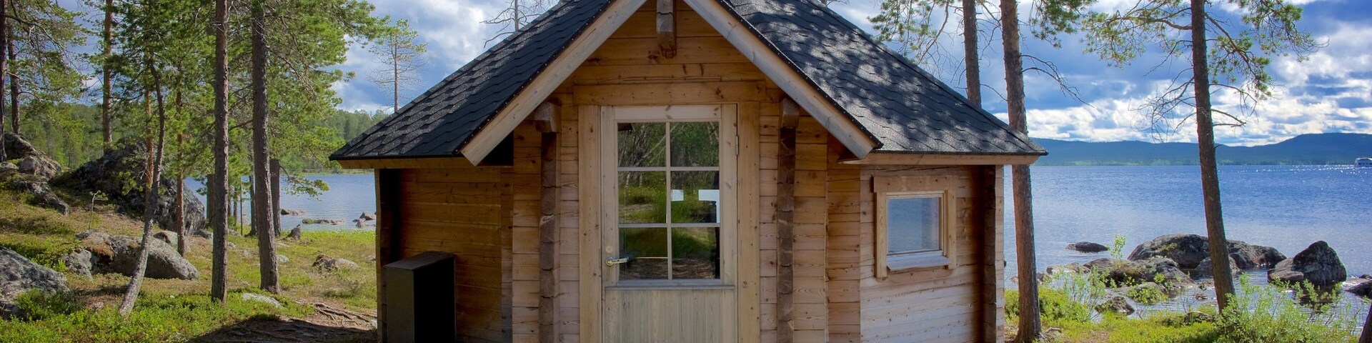 Inari which includes a house, a lake or waterhole and tranquil scenes