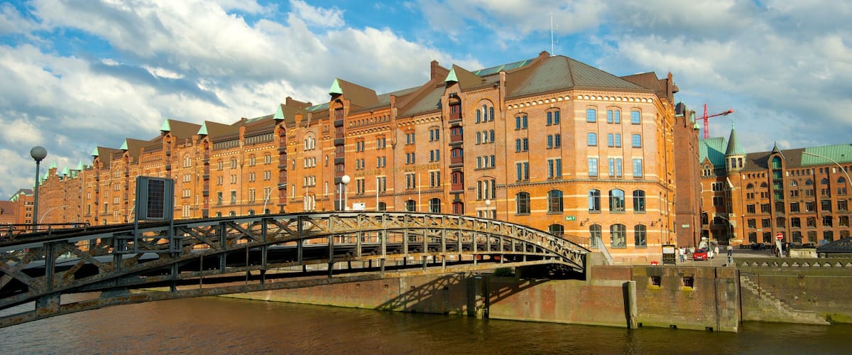 Speicherstadt showing a city, a bridge and a river or creek