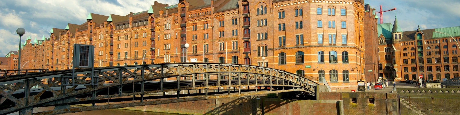 Speicherstadt showing a city, a bridge and a river or creek