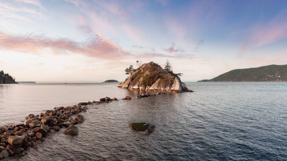 Aerial Panoramic View of Rocky Island on the Pacific Ocean West Coast.