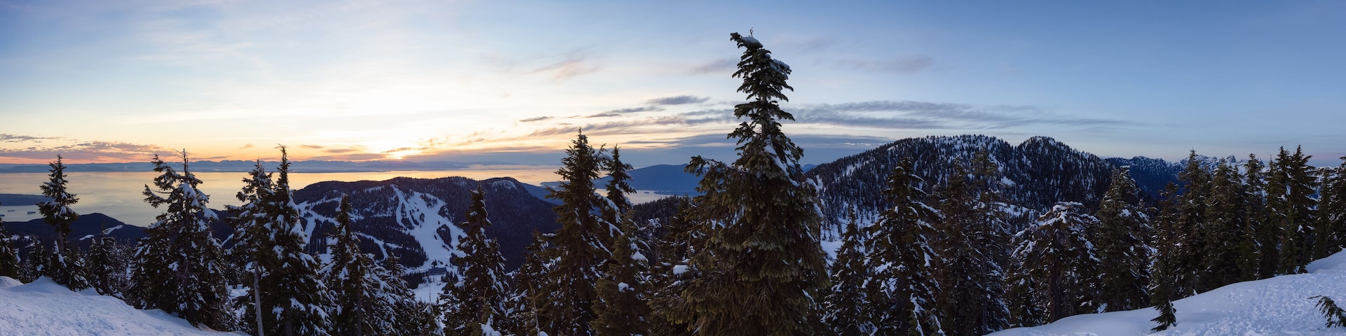 Sunset Panoramic View from top of Hollyburn Mountain in Winter Season. West Vancouver, British Columbia, Canada. Canadian Nature Background Panorama